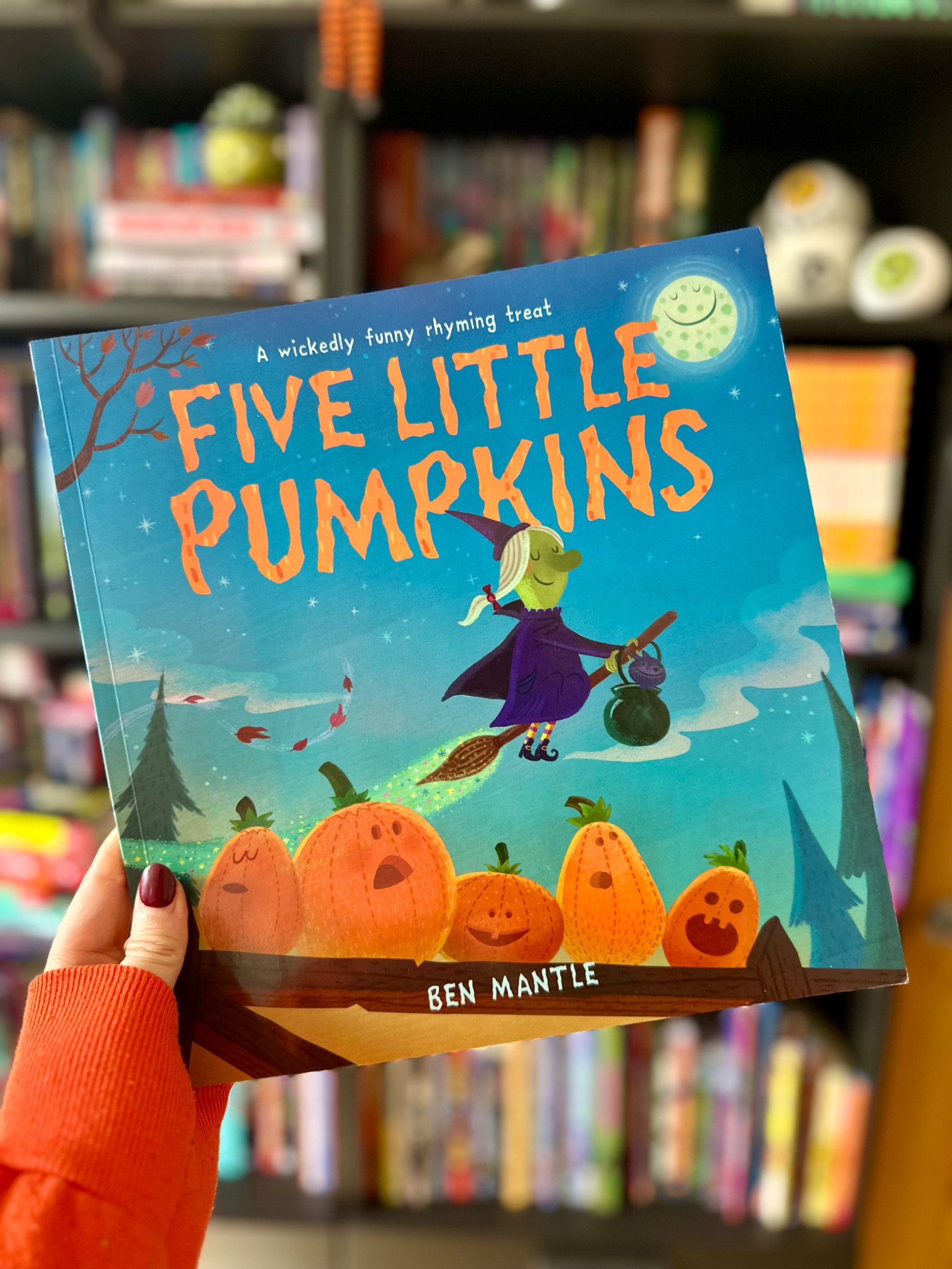 October Jones holding Five Little Pumpkins